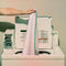 Woman placing the pillow protector in a washing machine